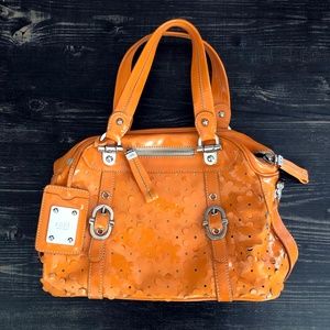 Rafe Handbag Orange Patent Leather with Flower Cutouts